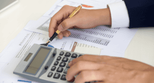 Real estate agent reviewing home value documents with client home appraisal Roseville CA